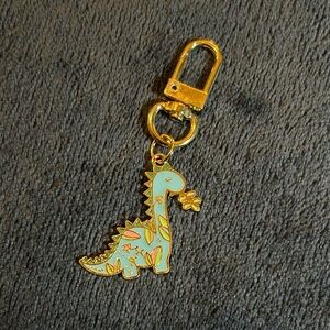 Dinosaur with Flower Print Enamel and Metal Keychain